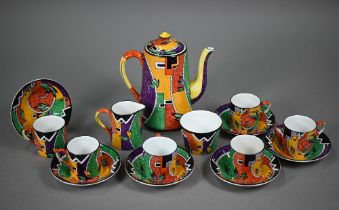 An Art Deco pottery coffee service printed with polychrome abstract designs, comprising coffee