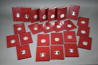 A set of twenty-four Birmingham Mint silver commemorative medallions in the 'Discovery in Silver'