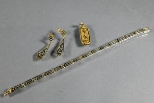 A yellow metal linked bracelet with matching drop earrings in the Greek key pattern, stamped 585,