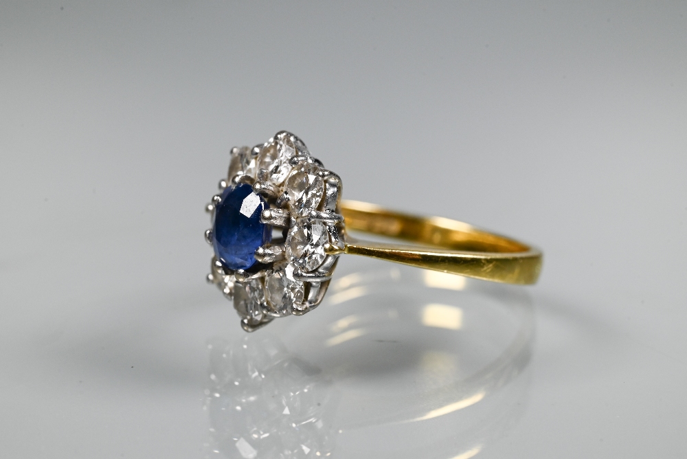 A sapphire and diamond cluster ring, the claw set blue sapphire surrounded by eight brilliant cut - Image 3 of 6