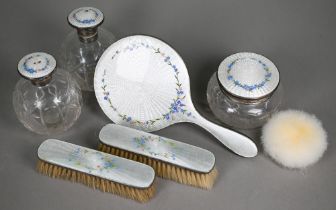 A silver and floral-decorated enamel brush set, London 1927, to/w a matching pair of globular