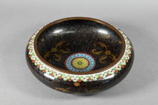 A 20th century Chinese cloisonne black ground brush washer with stylised floral design surrounding