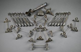 A set of twelve German silver sardine forks with loaded handles, to/w a set of twelve unmarked (