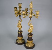 A pair of continental bronzed and ormolu four-sconce candelabra with figural pillars, 59 cm high o/a