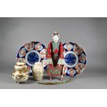 A vintage Chinese 'Opera Doll' 27 cm to/w two 19th century Japanese Imari plates, 20 cm diameter,