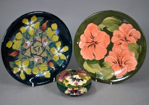 A Moorcroft green-glazed 'Hibiscus' plate 26cm, with paper Royal Warrant label to/w a blue-ground '