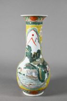 A 19th century Chinese famille jaune vase, painted in polychrome enamels with idyllic landscapes and