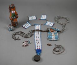 A Native American corncob doll with beadwork decoration, 19 cm high to/w a beadwork chest-ornament