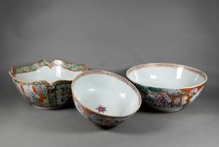 An 18th century Chinese famille rose punch bowl painted in polychrome enamels with alternating