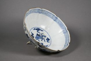 A Chinese blue and white lobed bowl painted on the exterior with mythical beasts amongst stylised