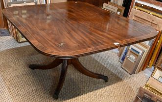 A Victorian brass inlaid mahogany breakfast table, the rectangular top with rounded corners,