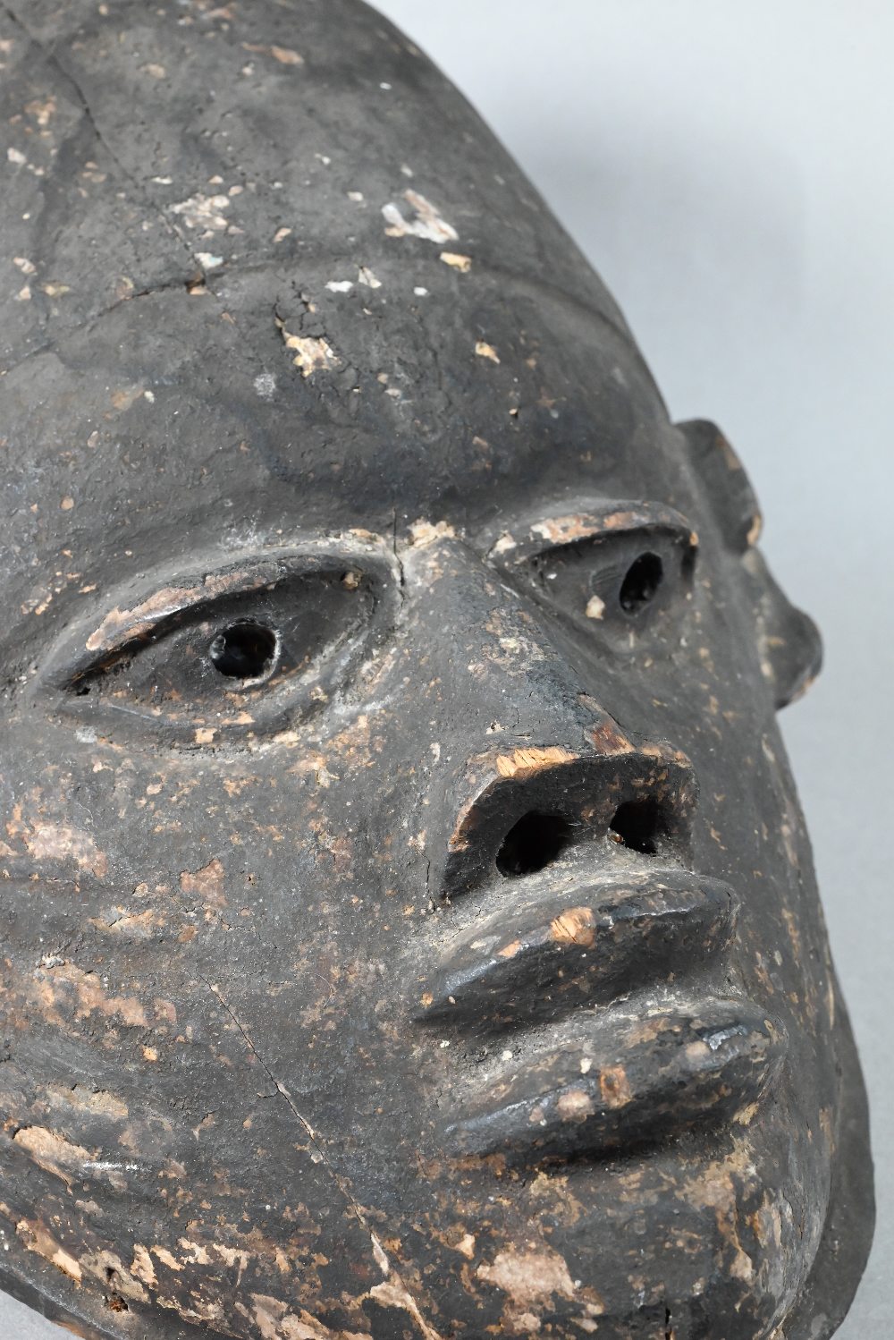 A 20th century stained and carved wood African tribal helmet mask, 32 cm - Image 3 of 6