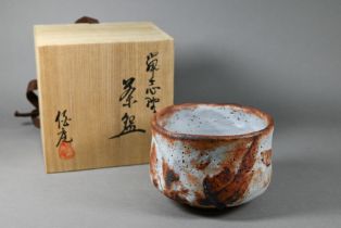 Soga Hakuan (b.1922) - A Japanese Shino ware Chawan bowl, of irregular form with a light blue
