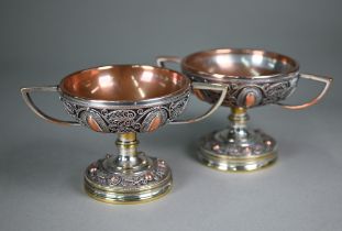 A pair of 19th century Continental plated on copper garniture vases with twin handles, wire filigree