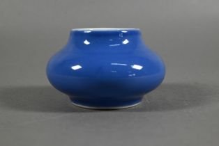 A Chinese monochrome powder blue brush washer/water pot of compressed globular form, blue glaze with