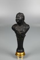 A desk seal in the form of a Continental character, possibly Wedgwood black basalt, with stepped