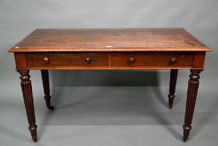 A Victorian mahogany two drawer side table, raised on turned reeded legs to brass castors, 122 cm