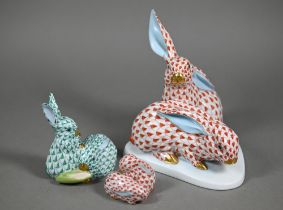 A Herend red-scale group of two rabbits, 15 cm high to/w a smaller green-scale two rabbit group 8.