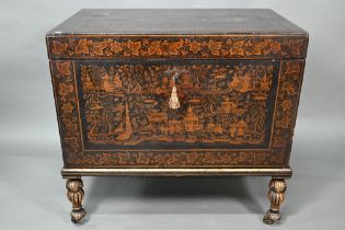 A late 18th/19th century Chinese export all-round black and gilt pictorial lacquered trunk, raised