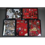 Five perspex display cases of approx 250 British military cap badges and insignia including RAF
