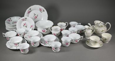 A Victorian floral-painted china mixed set of fourteen tea/coffee cups and saucers with slop-bowl