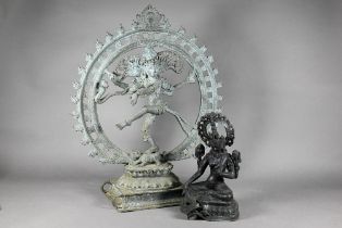 A 20th century Indian bronze figure of Shiva Nataraja dancing within a flaming halo with one foot on