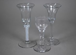 A Georgian cordial glass with campana bowl on opaque twist baluster stem, 16 cm high to/w a plain