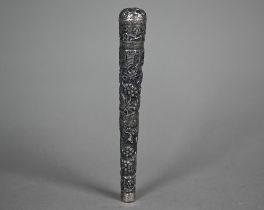 A Burmese low-grade silver parasol handle, chased with jungle village and tiger chasing deer, 19cm