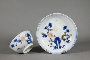 An 18th century Chinese blue and white 'Nanking Cargo' tea bowl and saucer, painted in underglaze