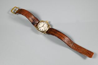 A WWII period gents Rolex Oyster wristwatch, yellow metal 27 mm cushion case, the dial with Arabic