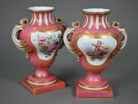 A pair of 19th century Sevres porcelain vases with twin foliate handles, on stemmed square bases,