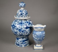 An 18th century Delft blue and white case and cover of octagonal baluster form, painted with