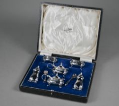 A cased six-piece silver condiment set with two spoons, Walker & Hall, Birmingham 1936, 7.5oz (net