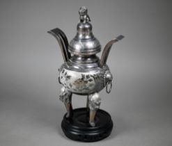 A Chinese Republic silver censer, the domed cover surmounted by kylin, the globular body with two