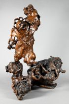A Chinese carved root wood father and son figure group on gnarled naturalistic base, 38 cm high