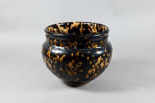 A Chinese Jizhou style stoneware alms bowl in the Song dynasty manner, dark and buff mottled '