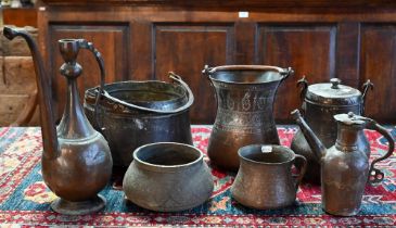 A collection of antique Persian Qajar Islamic tinned copper metal ware including a large slender