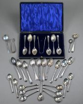 An Edwardian cased set of six coffee spoons and tongs with shell bowls, London 1903, to/w eleven
