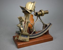 A vintage brass sextant by J Coombes, Devonport, named for Captain Kerrison Kiddle MBE RN 1876-1949