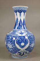A late 19th century Chinese blue and white vase, the flared neck painted with diaper, ruyi-head