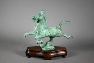 A 20th century Chinese small bronze copy of 'The Flying Horse of Gansu' with applied verdigris
