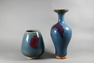 A Chinese Jun Yao style lotus bud vase evenly covered with a crackled turquoise glaze with large