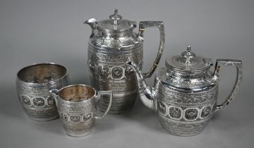 A 19th Century plated on copper four-piece tea service, decorated with Tibetan style Zodiac designs,