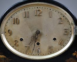 An early 20th century chinoiserie cased black and gilt lacquered mantel clock with continental three