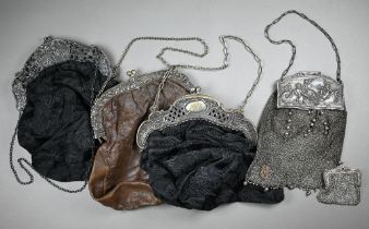A black satin evening bag, the silver hinged top chased with Rembrandt's 'Night Watch' flanked by