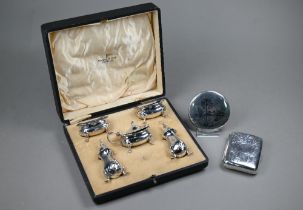 A cased silver five-piece condiment set on pad feet, Walker & Hall, Sheffield 1914, 5oz (net of blue