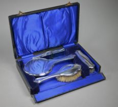 A cased silver four-piece brush set, Charles S. Green & Co. Ltd, London 1915-17 (little used)