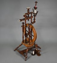 An antique turned wood small spinning wheel with bone-mounts, 73 cm overall