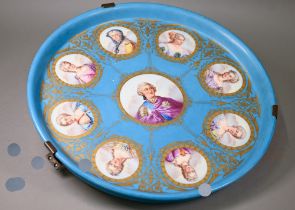 A 19th century Sevres porcelain large circular tray, painted with a portrait of Louis XV,