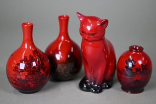 A Royal Doulton Flambe seated cat, 13 cm high to/w two small onion-shaped vases, Woodcut 1606 and